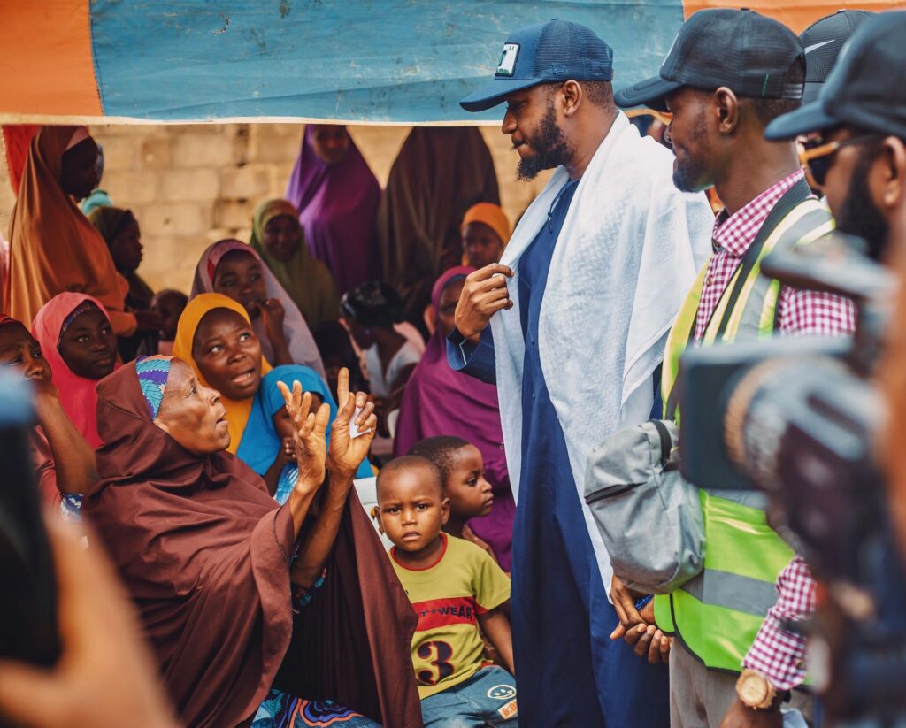 A large outdoor community gathering in Kaduna in traditional dress