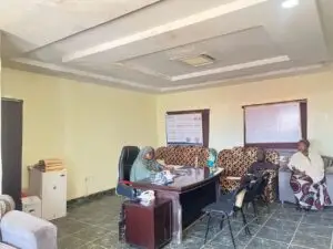 Advocacy team members meeting an official at the Zaria LGA Health Secretariat in Zaria, Kaduna