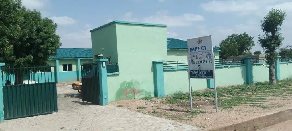 Entrance and signboard of Achika Health Centre in Wudil, Kano