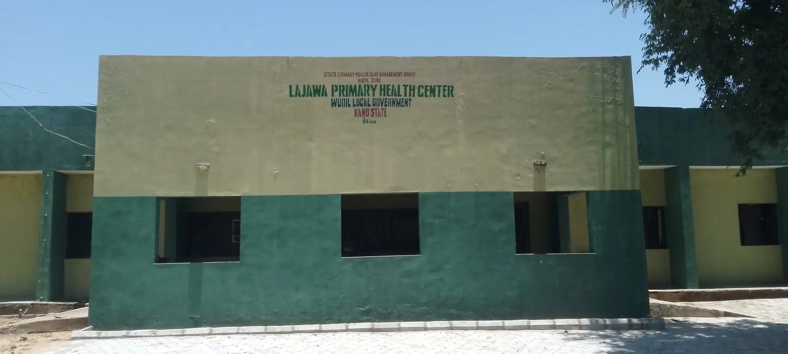 Front of a green-and-cream primary health centre building in Wudil, Kano